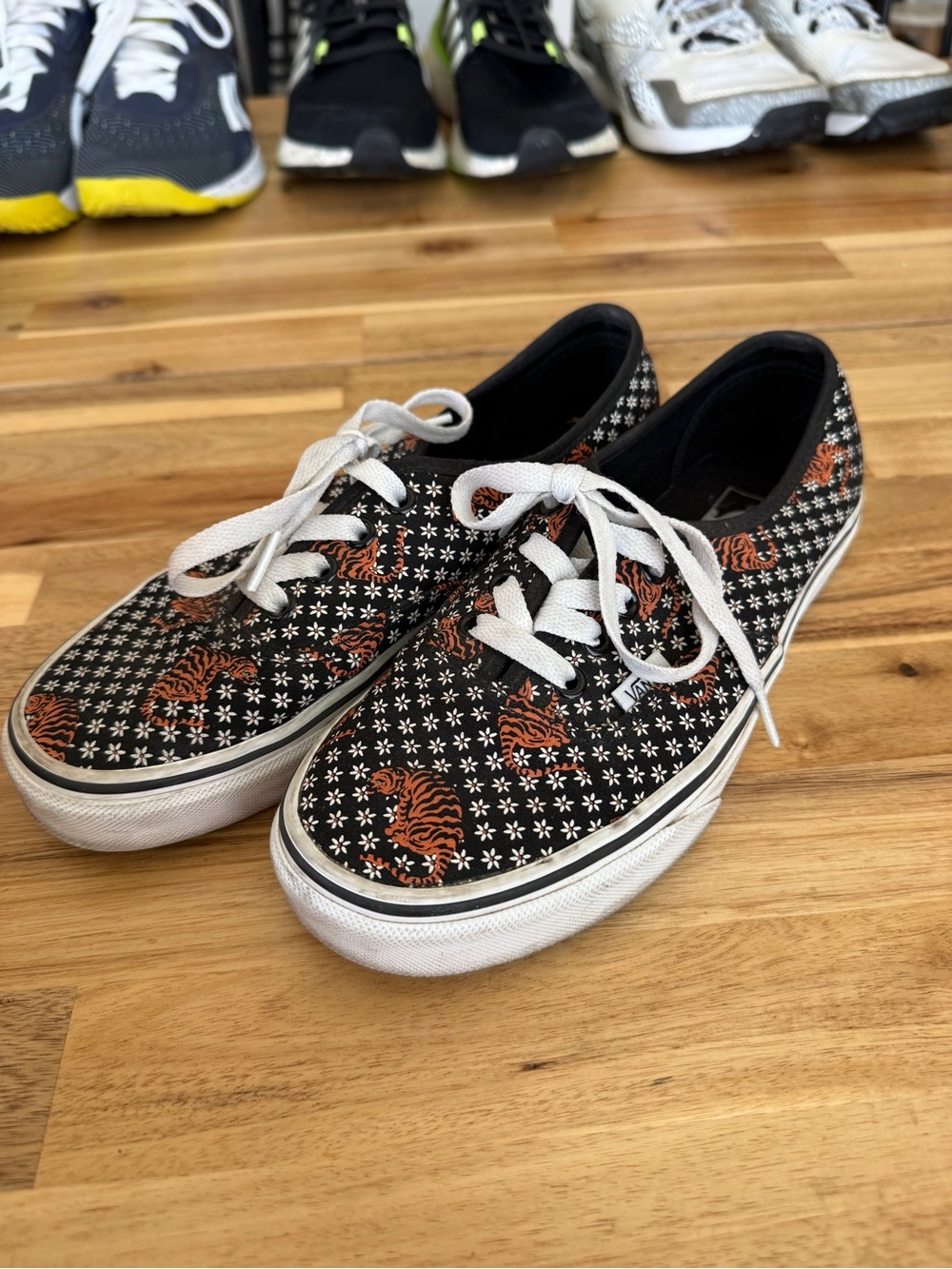 Black womens Lace-Up Canvas Vans with Orange Tiger Print